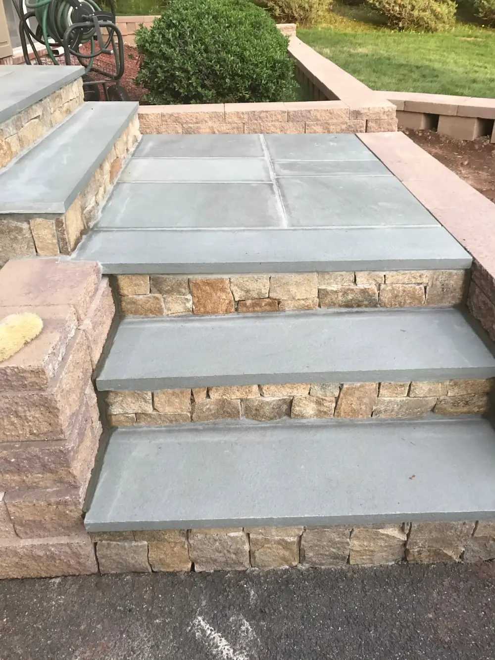 Custom Stone Steps & Raised Patio Installation